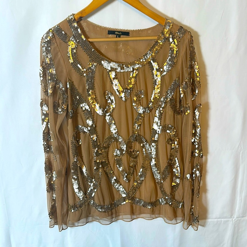Gold sequence over sheer nude blouse